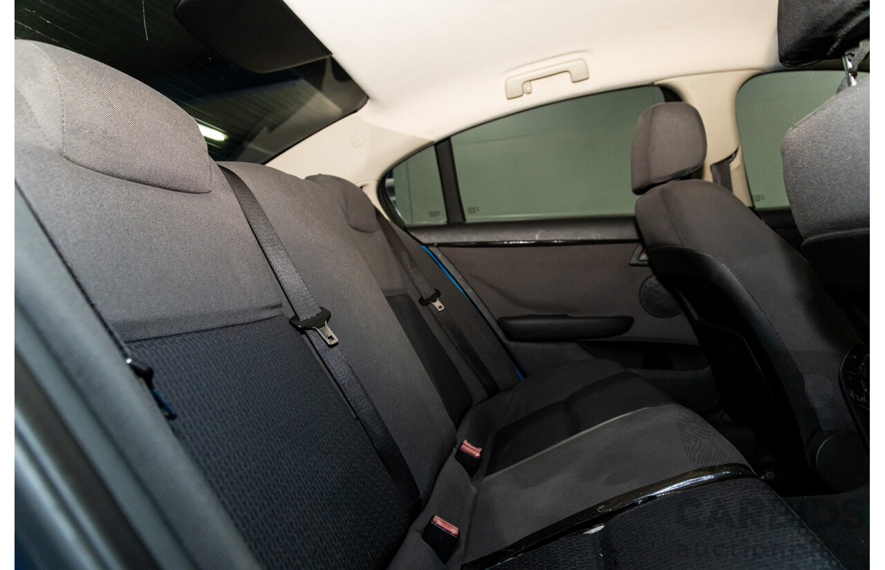 9/2009 Holden Commodore Omega VE MY10 4d Sedan Voodoo Blue Metallic V6 3.0L