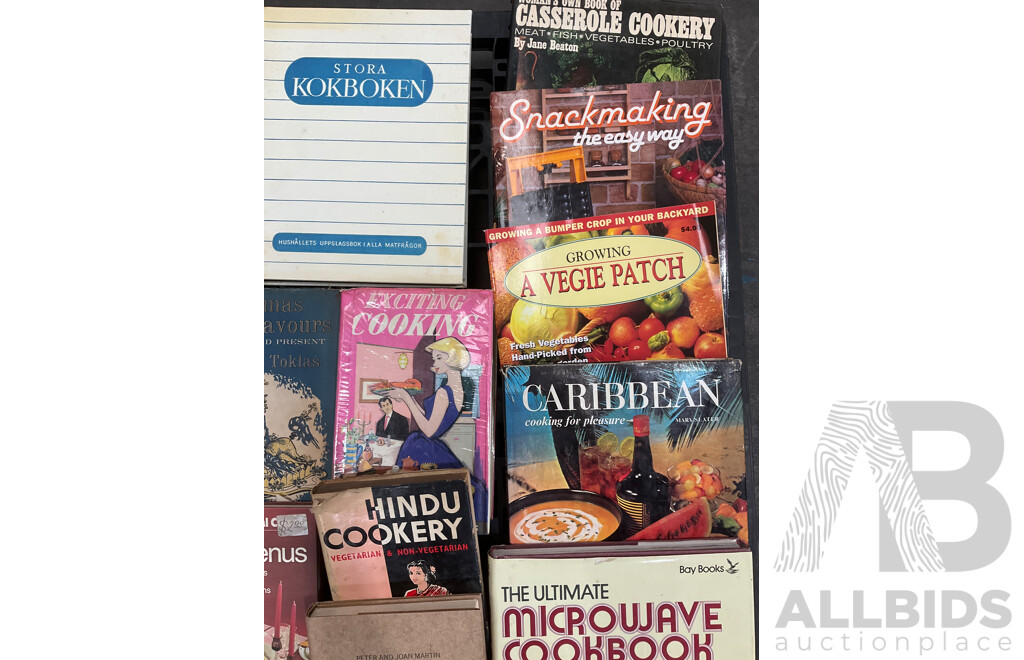 Collection of Vintage Cookbooks Spanning Various Cuisines and Baking Styles