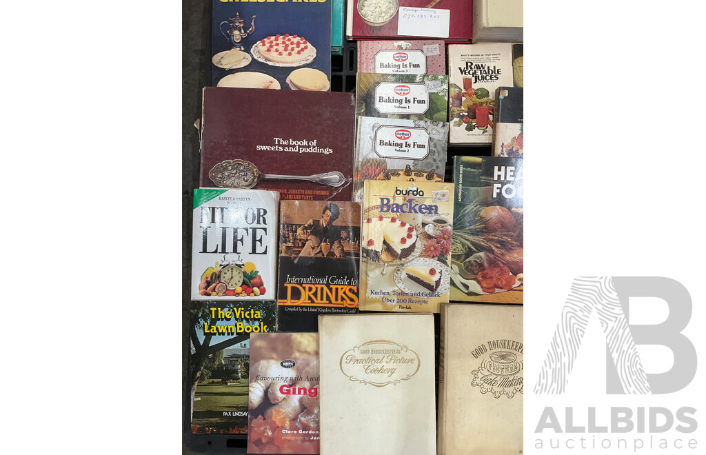 Collection of Vintage Cookbooks Spanning Various Cuisines and Baking Styles
