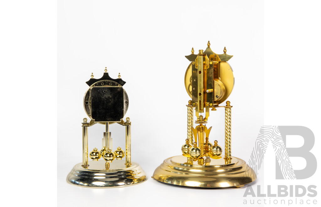 Pair of Graduated Glass Dome Anniversary Clocks with Rotating Pendulum by Prestige