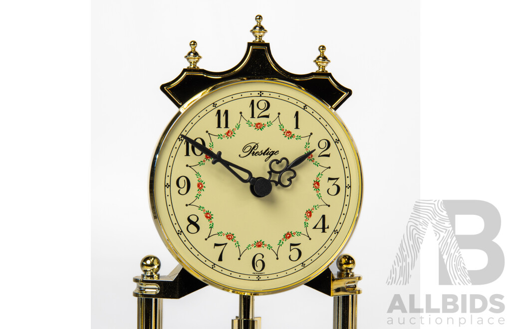 Pair of Graduated Glass Dome Anniversary Clocks with Rotating Pendulum by Prestige