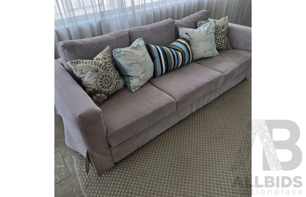 Entire Lounge Room Setting Including 2 X Three Seater Beige Microfibre Lounges, All Cushions, Rib Weave Natural Wool Rug and Designer Cross Base Glass Coffee Table