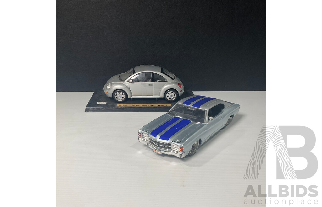Pair of Maisto Cars Including Volkswagen New Beetle and Chevrolet Chevelle 1:18 Scale Models