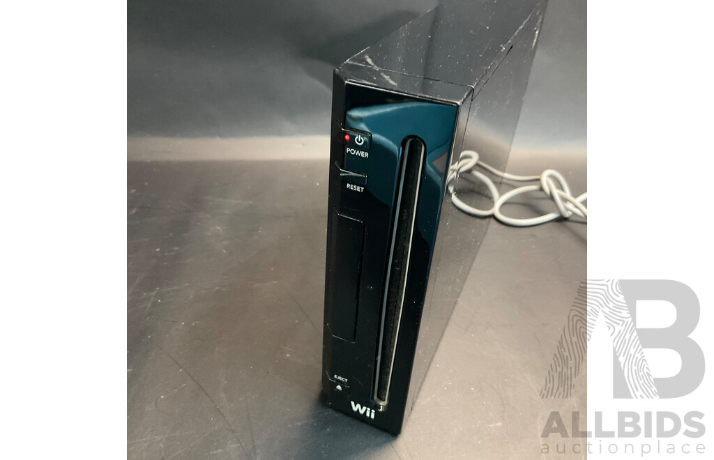 Nintendo Wii Console with Wii Fit Plus and MarioKart Game/Steering Wheel & Sports Pact 8 in 1 for Wii Sports Resort