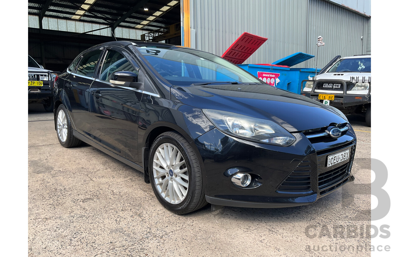 10/2011 Ford Focus Titanium LW 4d Sedan Ebony Black Metallic 2.0L