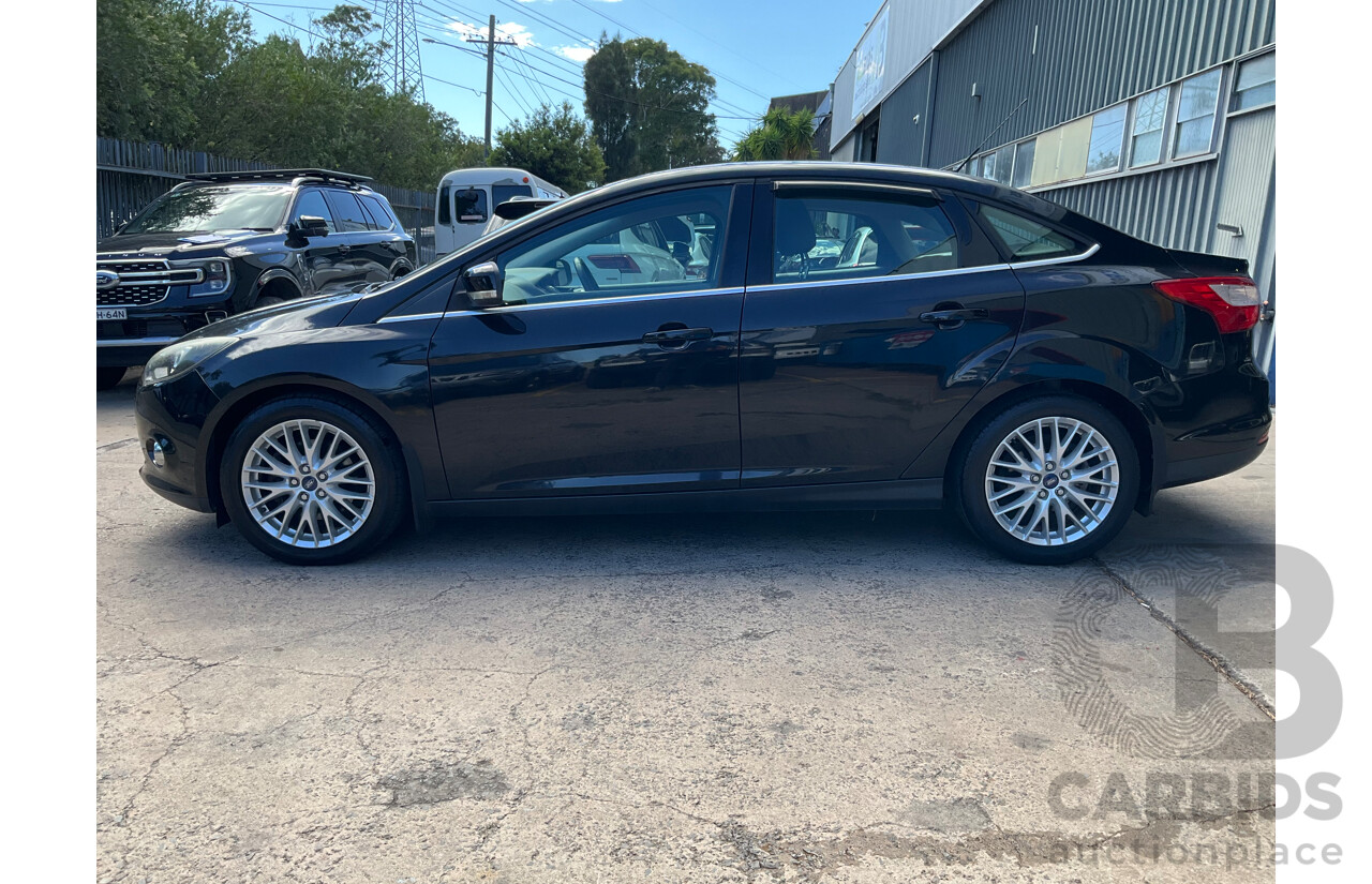 10/2011 Ford Focus Titanium LW 4d Sedan Ebony Black Metallic 2.0L