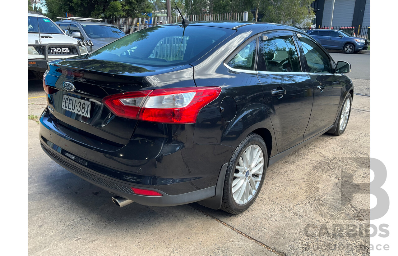 10/2011 Ford Focus Titanium LW 4d Sedan Ebony Black Metallic 2.0L