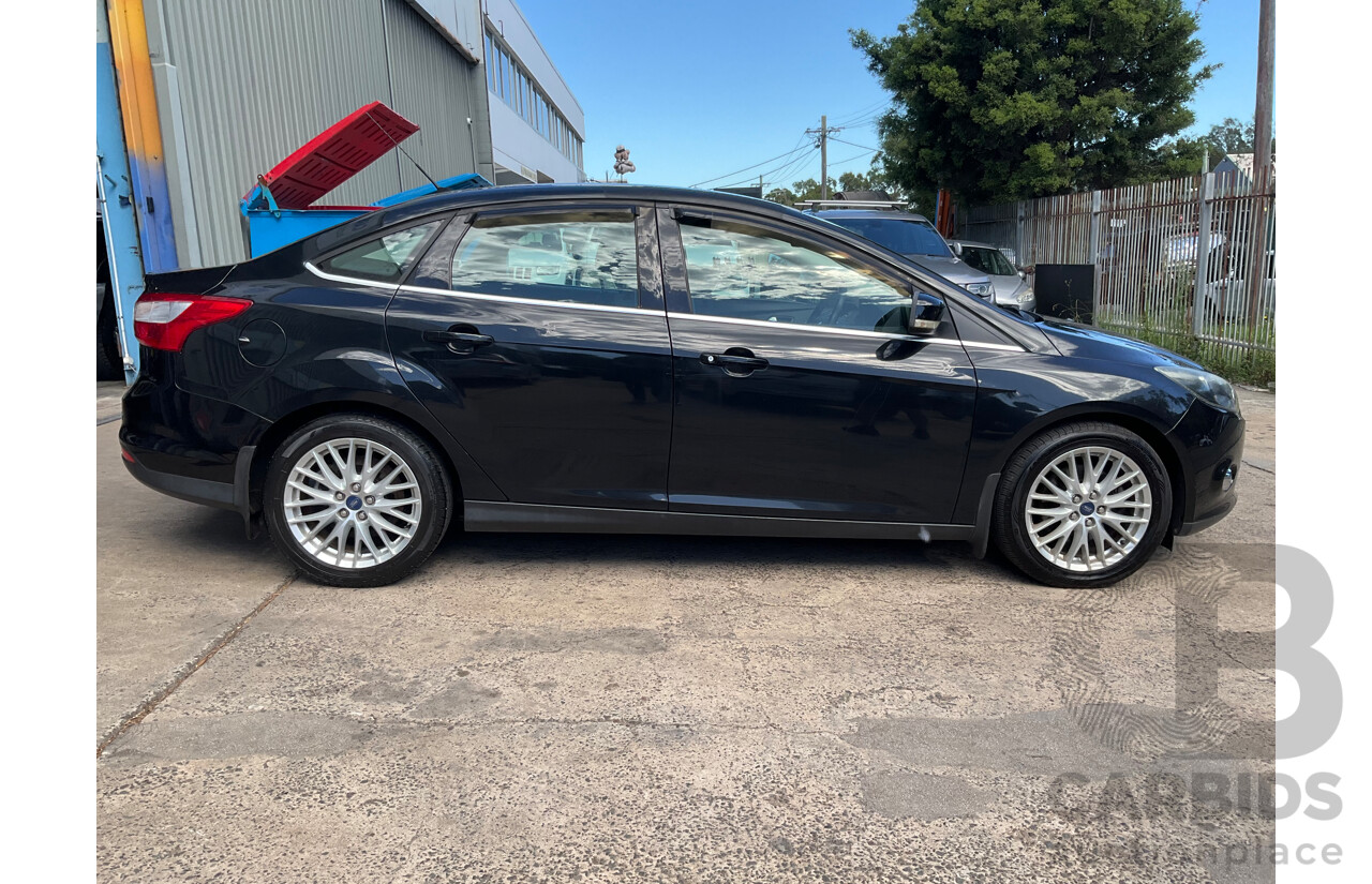 10/2011 Ford Focus Titanium LW 4d Sedan Ebony Black Metallic 2.0L
