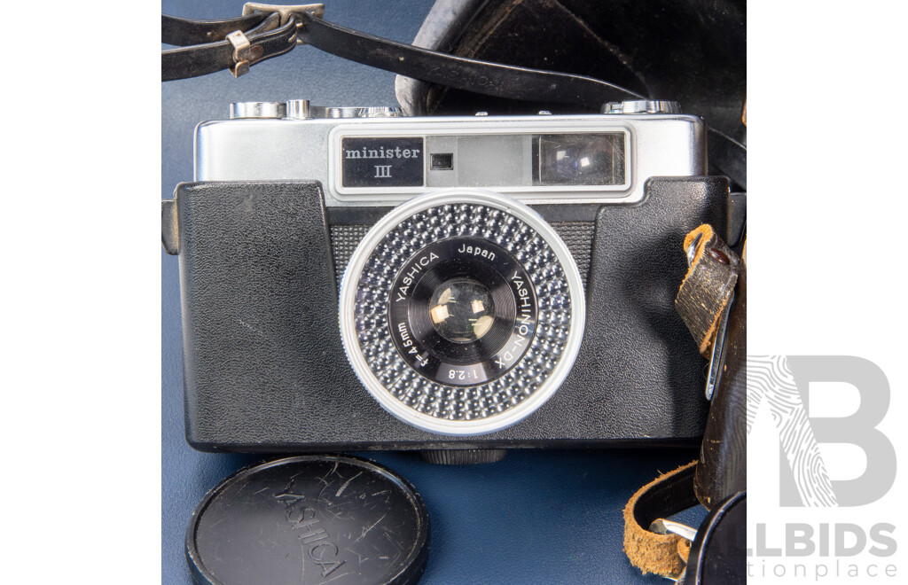 Pair of Vintage SLR Cameras Inc a Petri by Pentax and Yashica