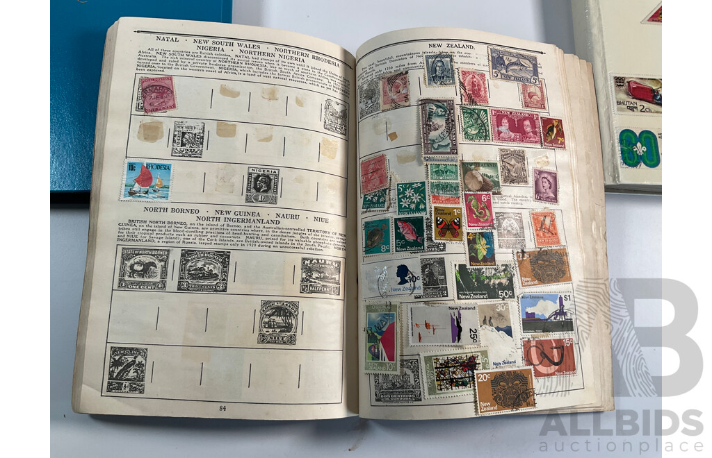 Four Albums of Vintage International Stamps Including ETA Postage Stamps of the World, Australian Predecimal, Ceylon Pakistan, France, Canada, New Zealand, Madagascar, South Africa, Uganda, Germany and More