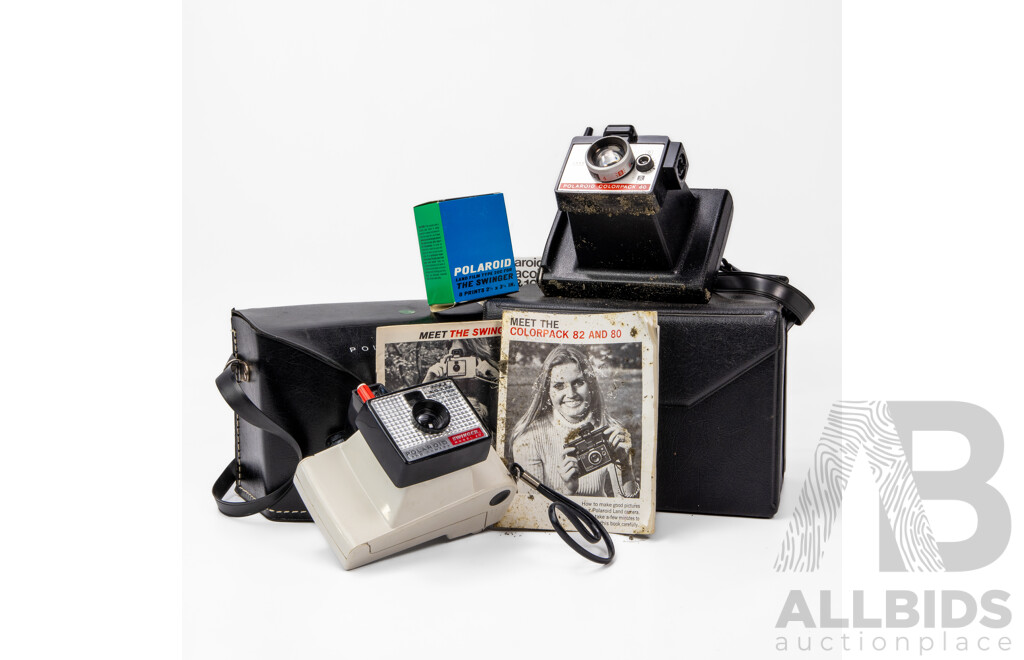 Two Vintage Polaroid Cameras with Carry Cases and User Manuals