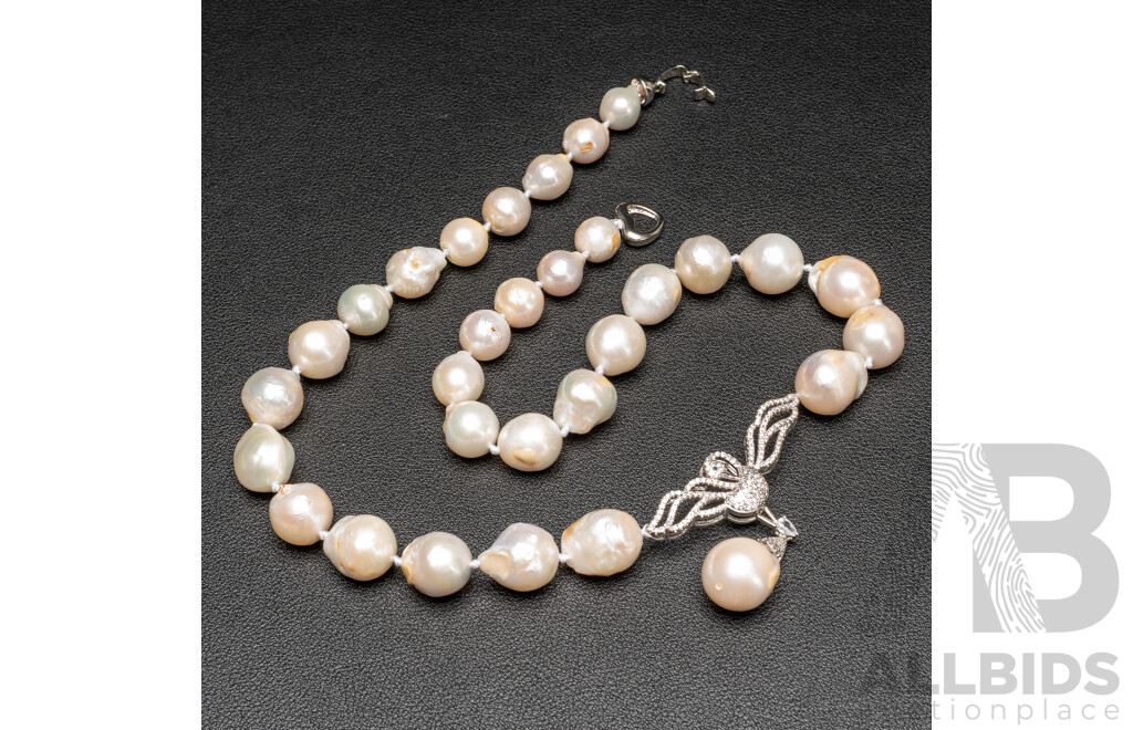 Baroque Freshwater Pearl Necklace with Silver Tone & Cubic Zirconia Swan Pendant. Length - 55cms