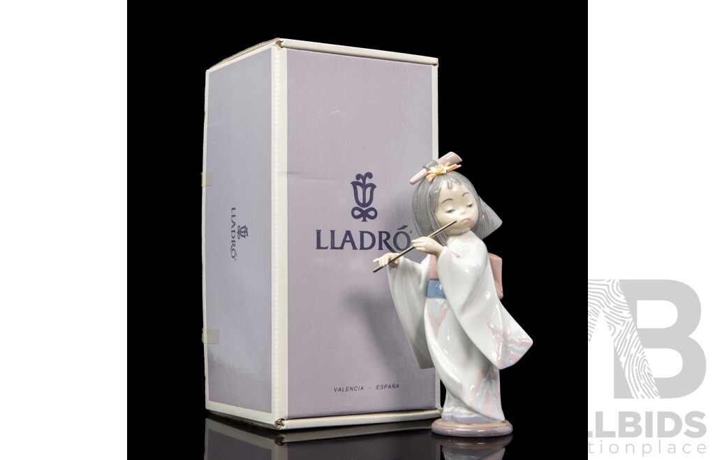 Boxed Lladro 'Playing the Flute' Porcelain Figure