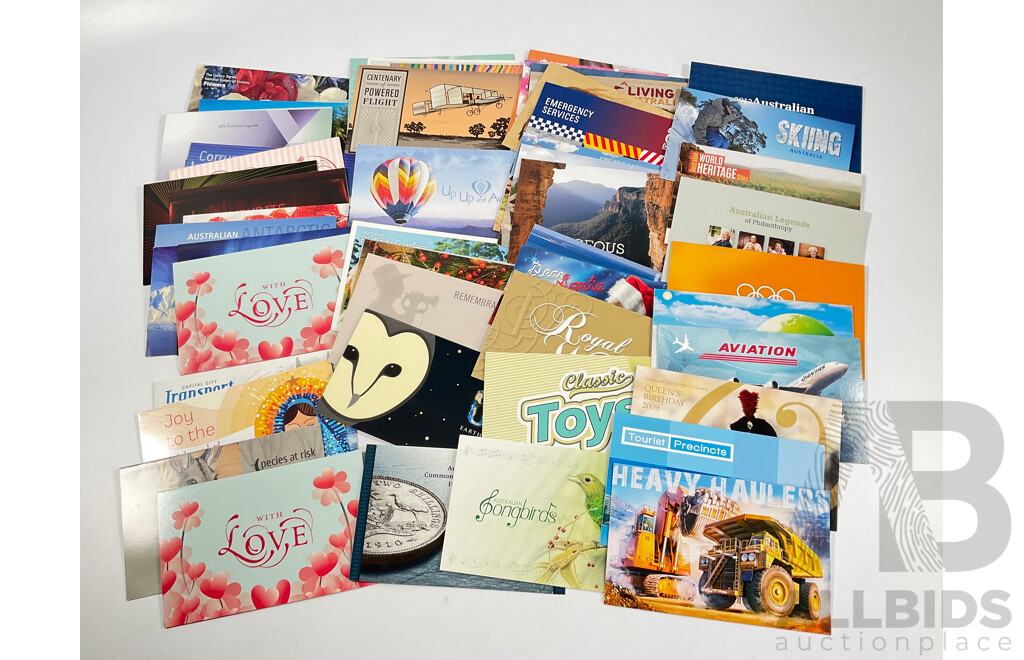 Fifty Six Australian Mint Stamp Packs Including Queensland 150 Years, Stargazing, Species at Risk, with Love, Beijing 2008, Gorgeous Australia, Living Green, Australian Commonwealth Coinage and More Face Value Approximately $217