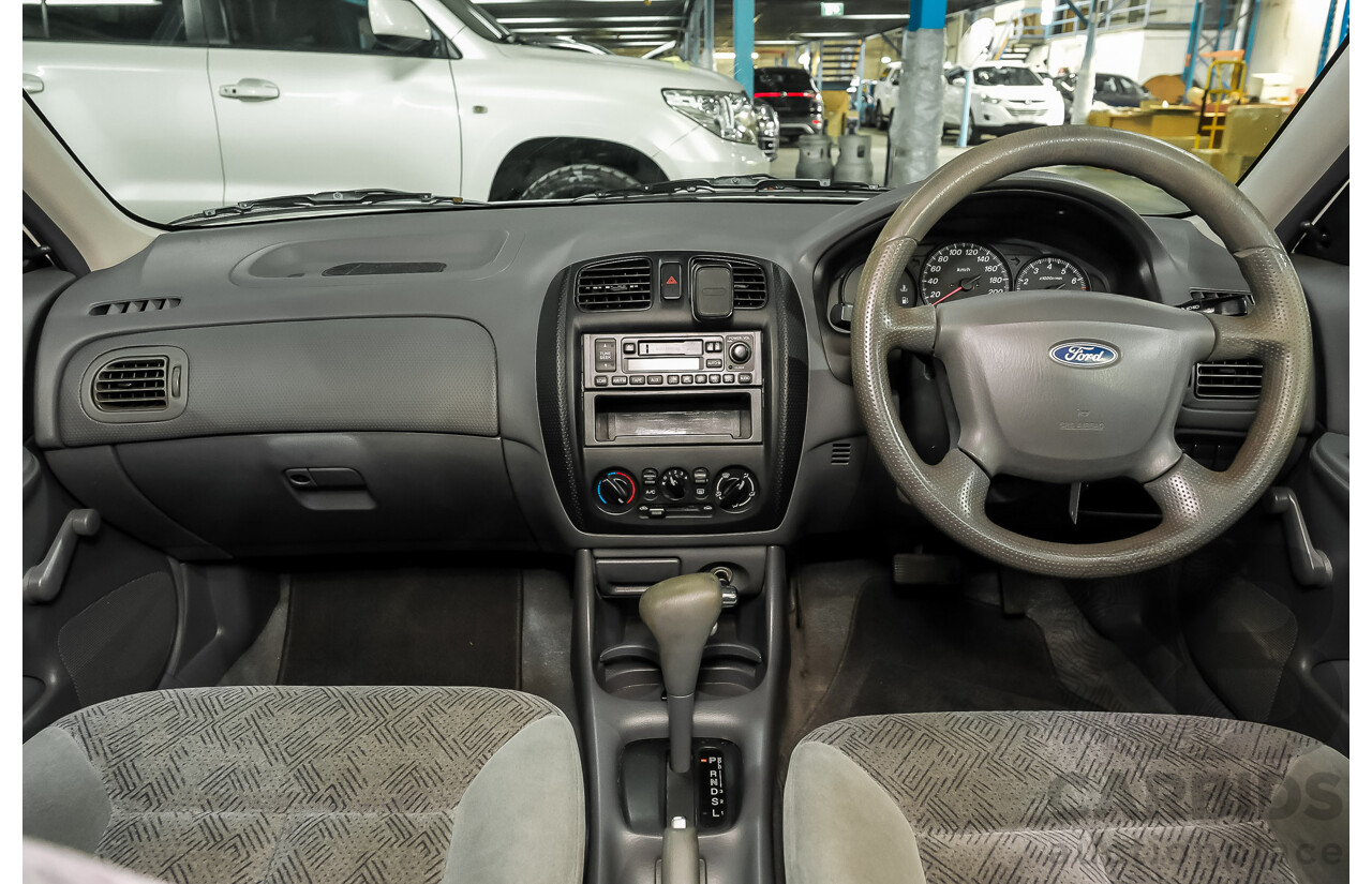 11/2000 Ford Laser GLXi KN 4d Sedan White 1.8L