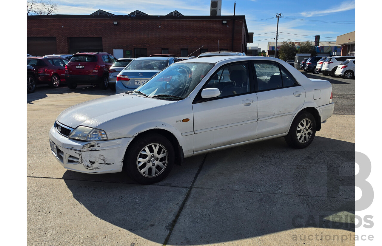 06/2001 Ford Laser GLXi KN 4d Sedan White1.8L