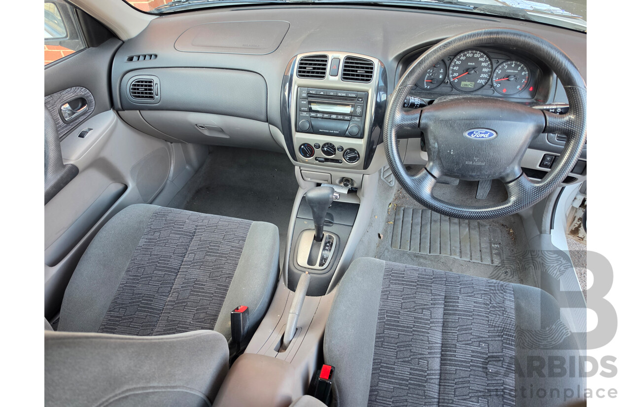 06/2001 Ford Laser GLXi KN 4d Sedan White1.8L