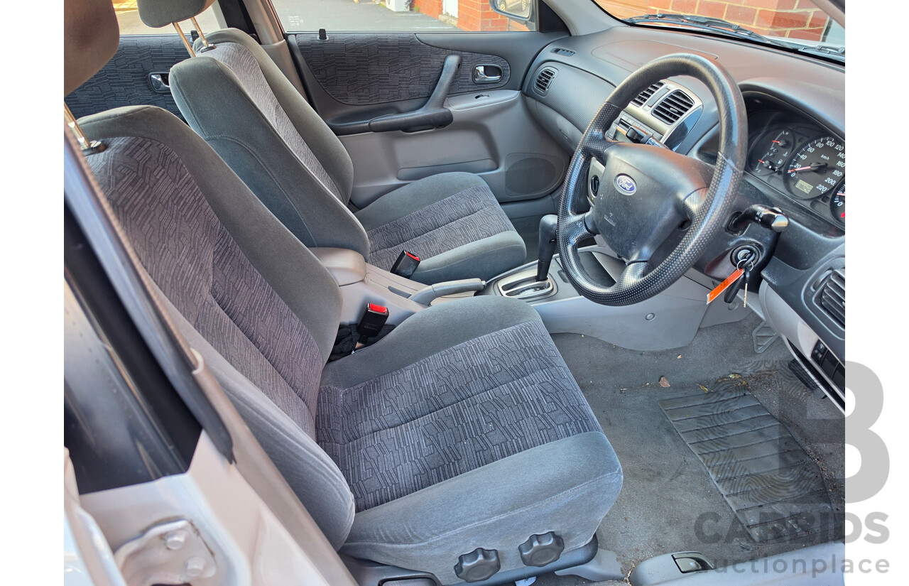 06/2001 Ford Laser GLXi KN 4d Sedan White1.8L