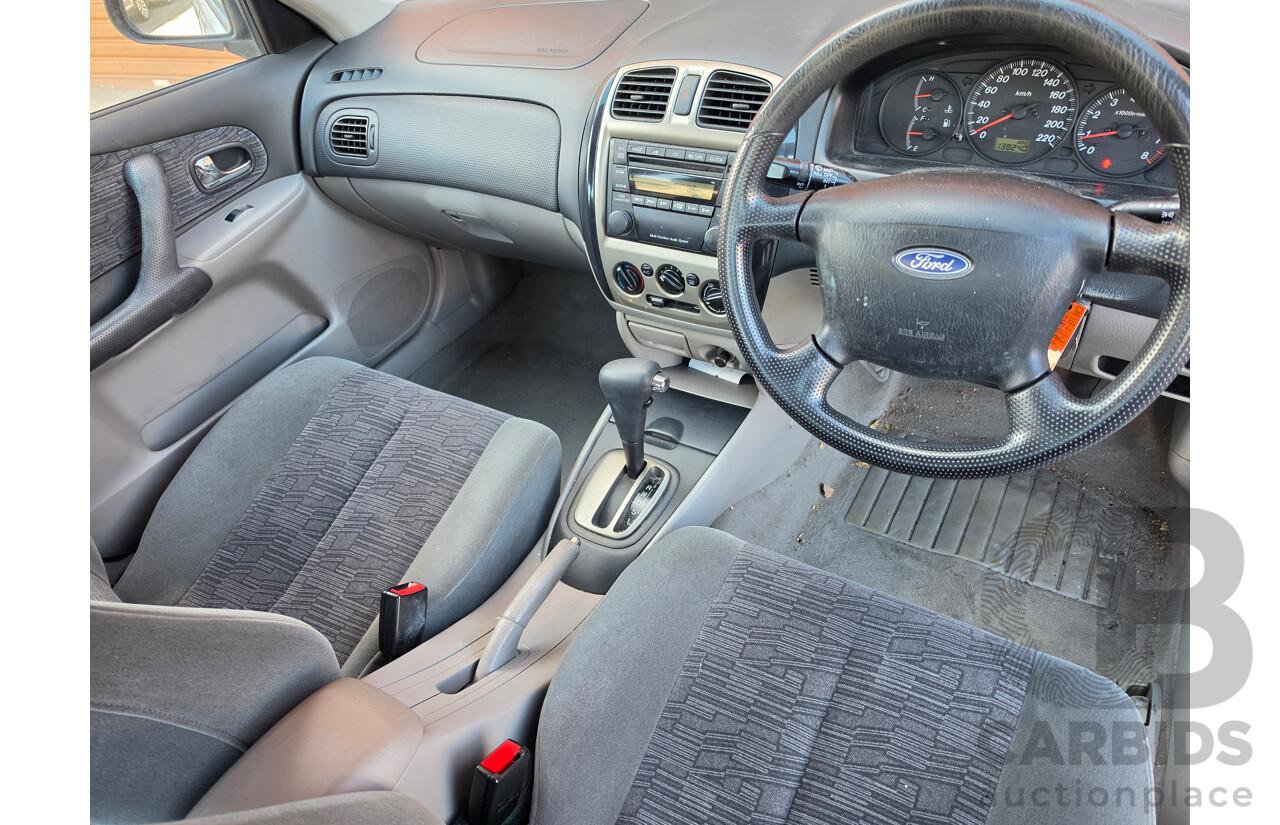 06/2001 Ford Laser GLXi KN 4d Sedan White1.8L