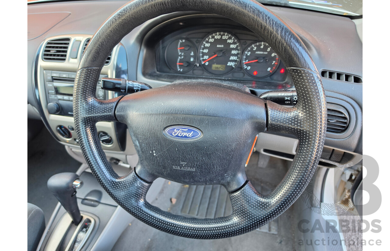 06/2001 Ford Laser GLXi KN 4d Sedan White1.8L