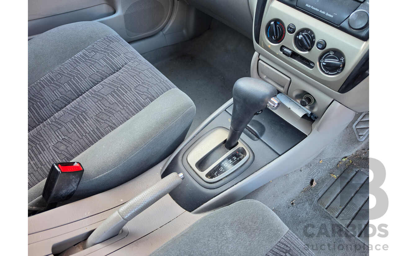 06/2001 Ford Laser GLXi KN 4d Sedan White1.8L
