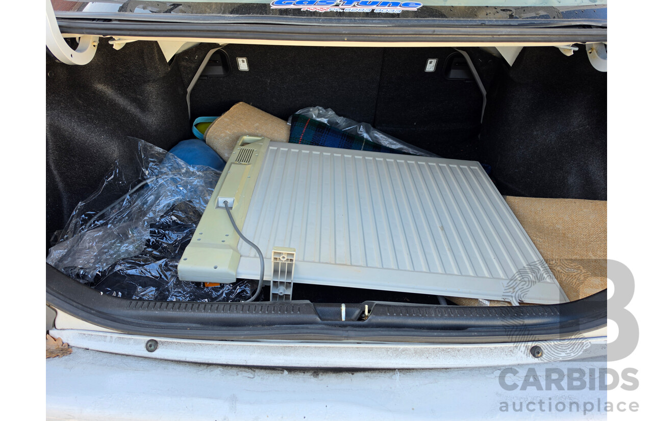 06/2001 Ford Laser GLXi KN 4d Sedan White1.8L