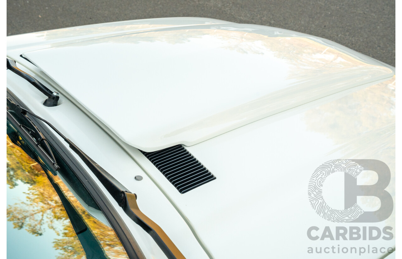 10/1984 Holden VK Commodore SL (134 Package) Group 3 Tribute 4d Sedan Alpine White V8 5.0L - Modified
