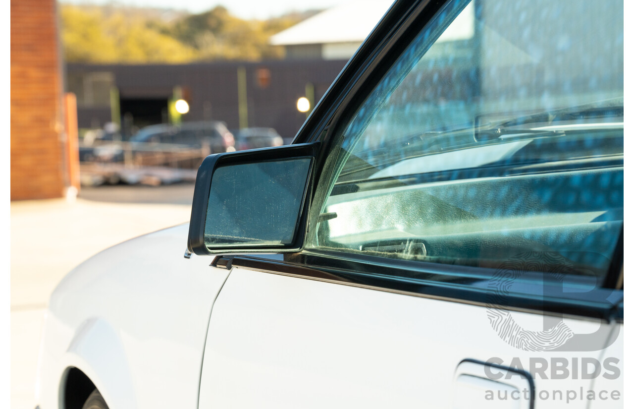 10/1984 Holden VK Commodore SL (134 Package) Group 3 Tribute 4d Sedan Alpine White V8 5.0L - Modified