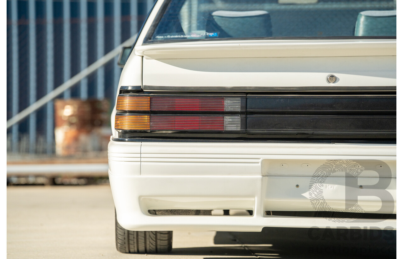10/1984 Holden VK Commodore SL (134 Package) Group 3 Tribute 4d Sedan Alpine White V8 5.0L - Modified