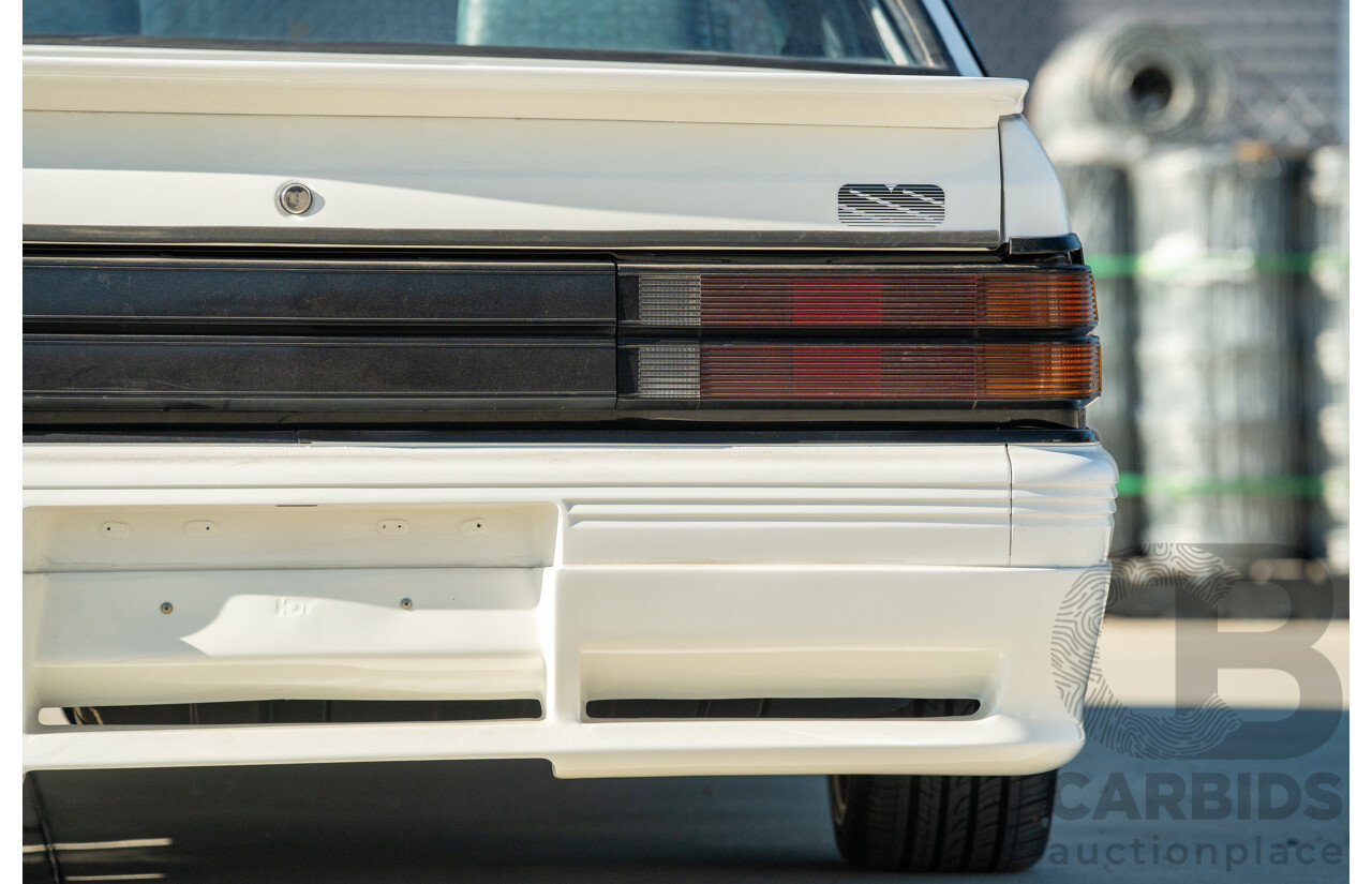 10/1984 Holden VK Commodore SL (134 Package) Group 3 Tribute 4d Sedan Alpine White V8 5.0L - Modified