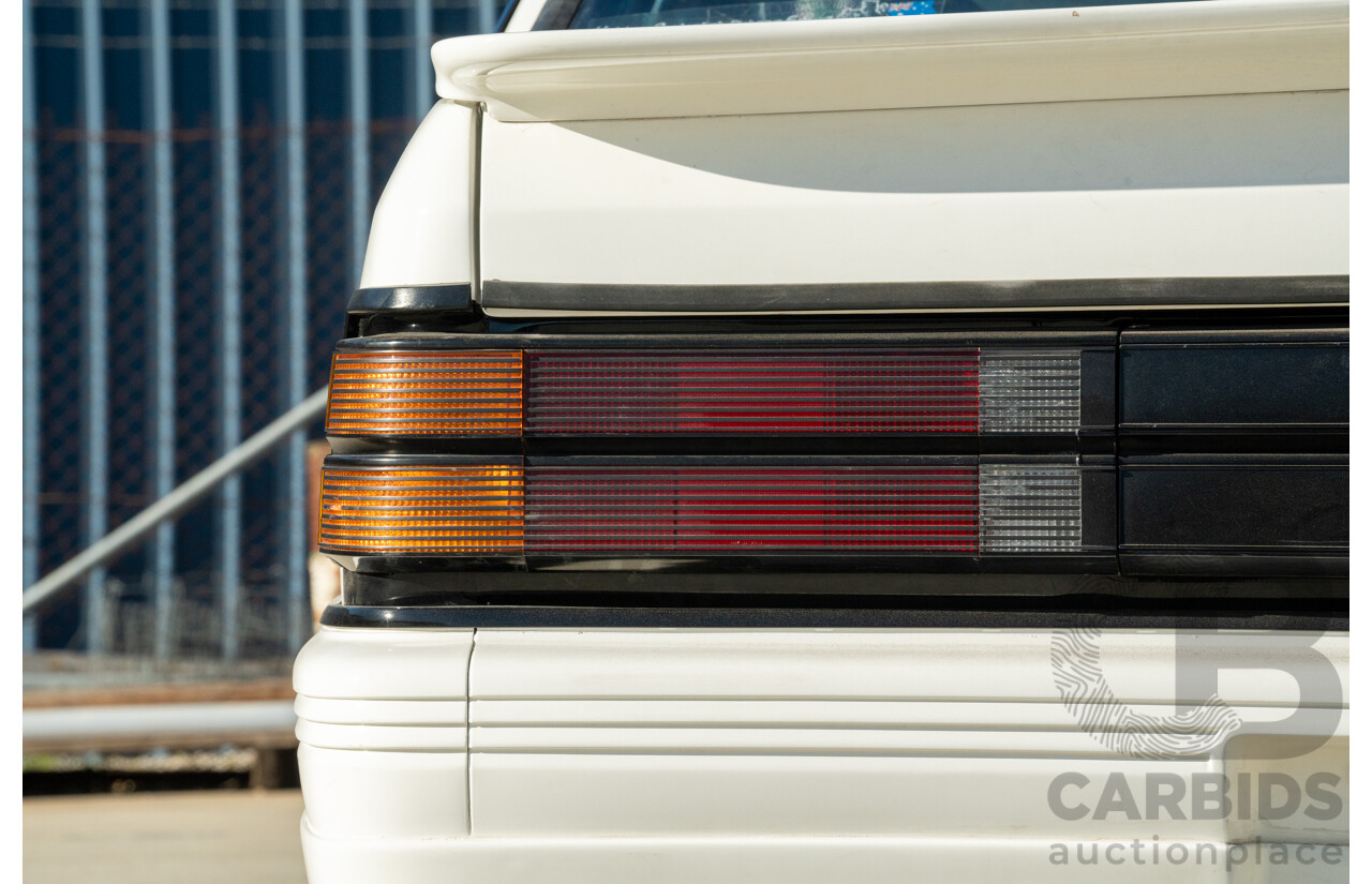 10/1984 Holden VK Commodore SL (134 Package) Group 3 Tribute 4d Sedan Alpine White V8 5.0L - Modified