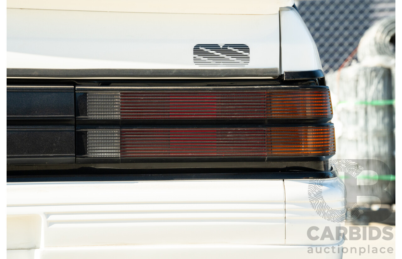 10/1984 Holden VK Commodore SL (134 Package) Group 3 Tribute 4d Sedan Alpine White V8 5.0L - Modified