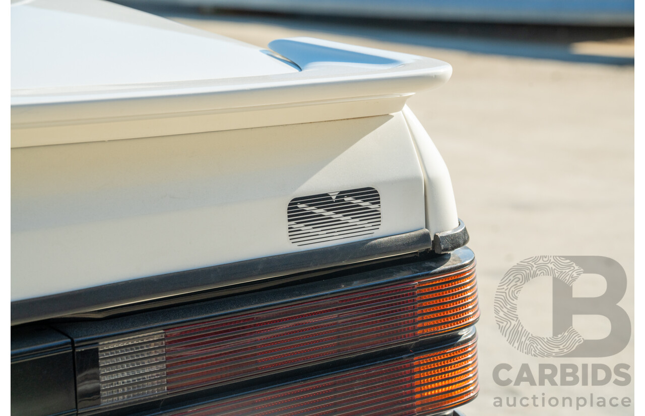 10/1984 Holden VK Commodore SL (134 Package) Group 3 Tribute 4d Sedan Alpine White V8 5.0L - Modified