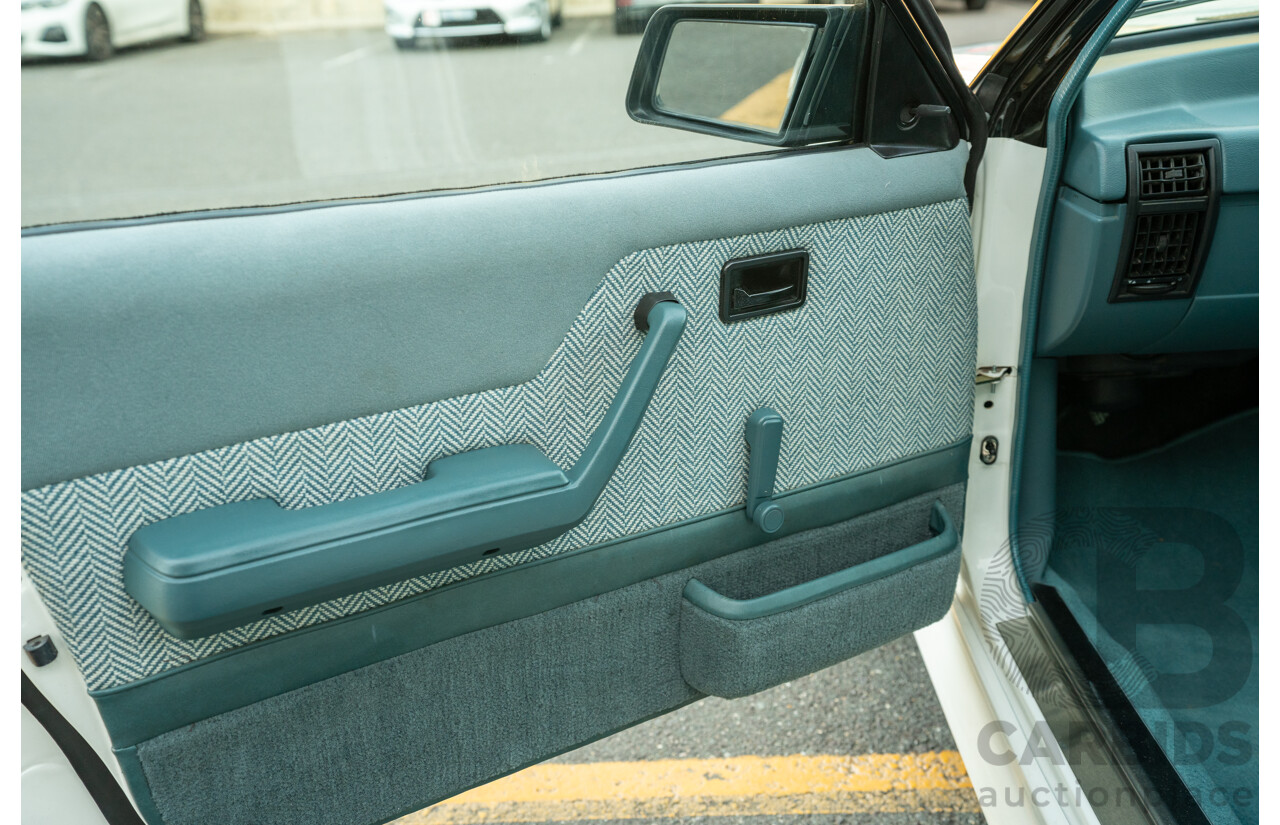 10/1984 Holden VK Commodore SL (134 Package) Group 3 Tribute 4d Sedan Alpine White V8 5.0L - Modified