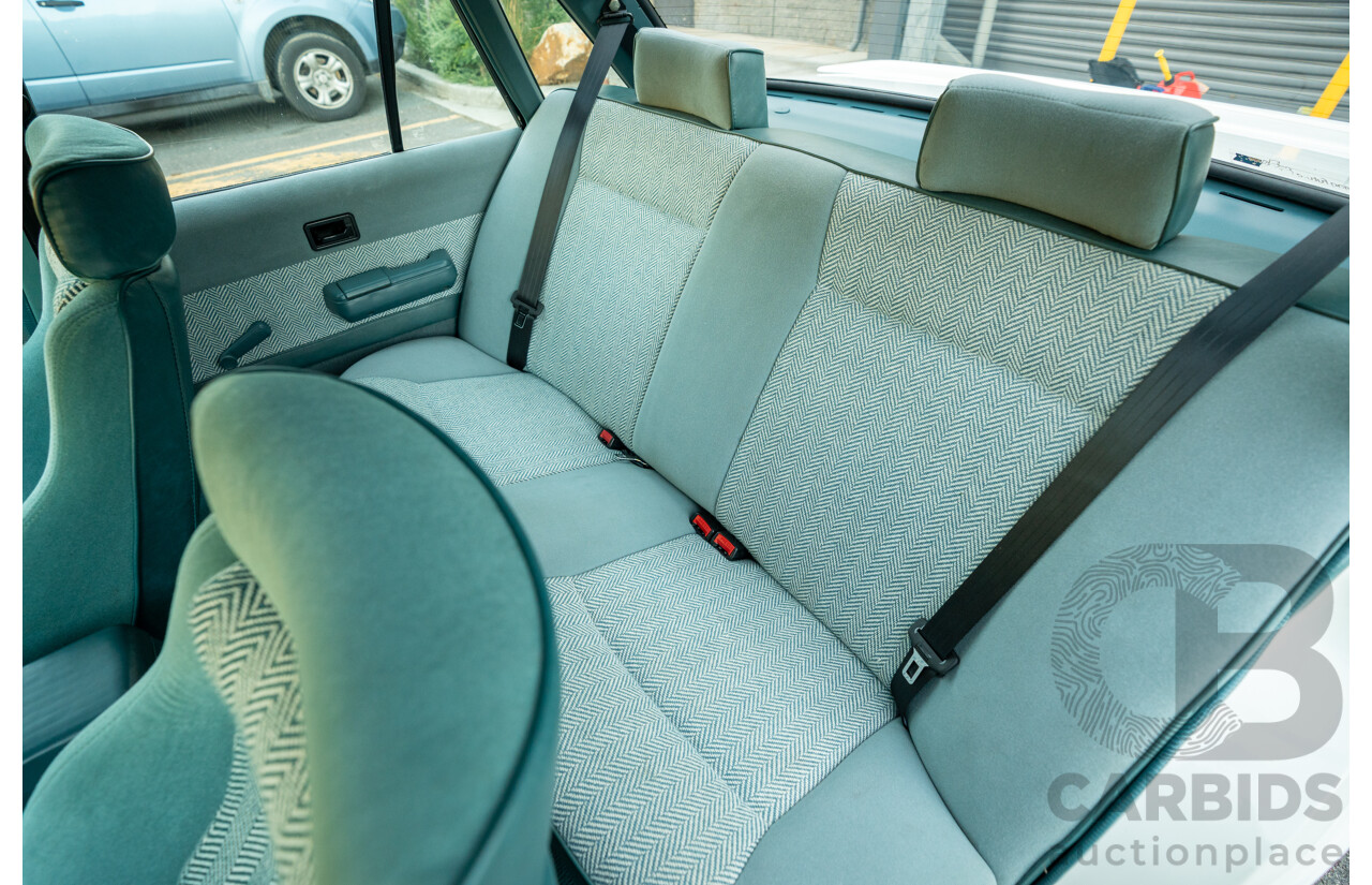 10/1984 Holden VK Commodore SL (134 Package) Group 3 Tribute 4d Sedan Alpine White V8 5.0L - Modified