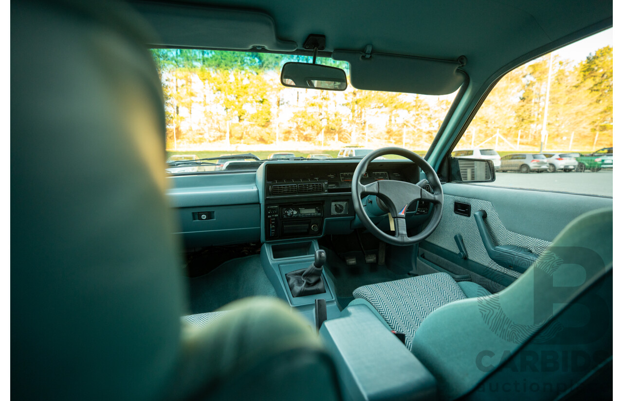 10/1984 Holden VK Commodore SL (134 Package) Group 3 Tribute 4d Sedan Alpine White V8 5.0L - Modified
