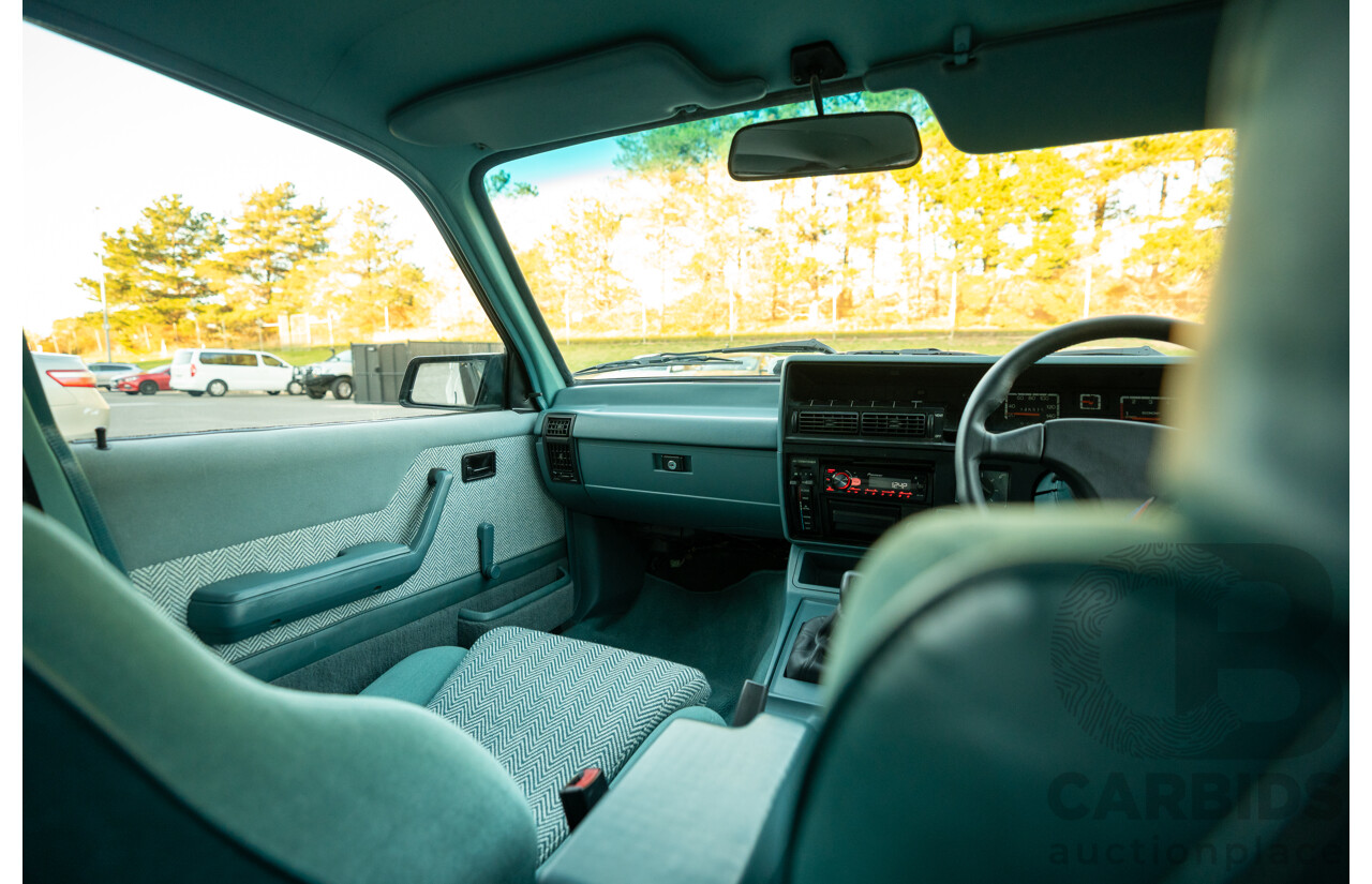10/1984 Holden VK Commodore SL (134 Package) Group 3 Tribute 4d Sedan Alpine White V8 5.0L - Modified