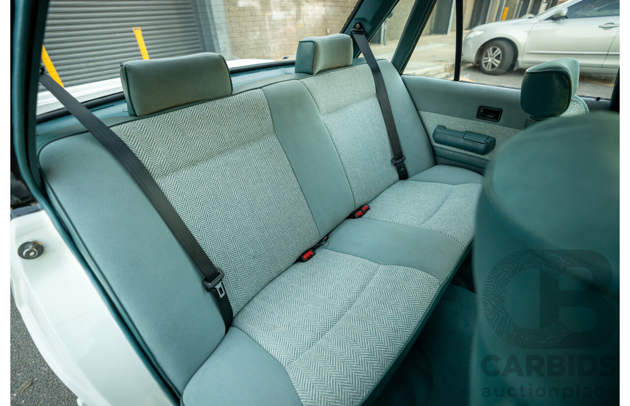 10/1984 Holden VK Commodore SL (134 Package) Group 3 Tribute 4d Sedan Alpine White V8 5.0L - Modified