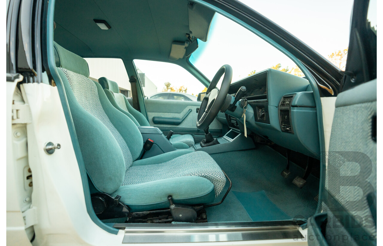 10/1984 Holden VK Commodore SL (134 Package) Group 3 Tribute 4d Sedan Alpine White V8 5.0L - Modified