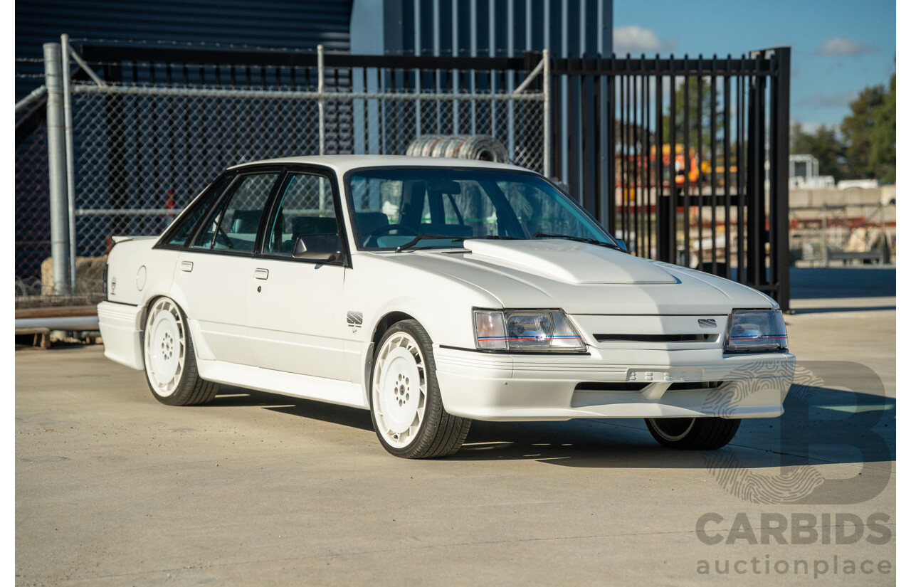 10/1984 Holden VK Commodore SL (134 Package) Group 3 Tribute 4d Sedan Alpine White V8 5.0L - Modified