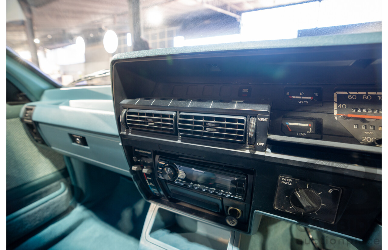 10/1984 Holden VK Commodore SL (134 Package) Group 3 Tribute 4d Sedan Alpine White V8 5.0L - Modified