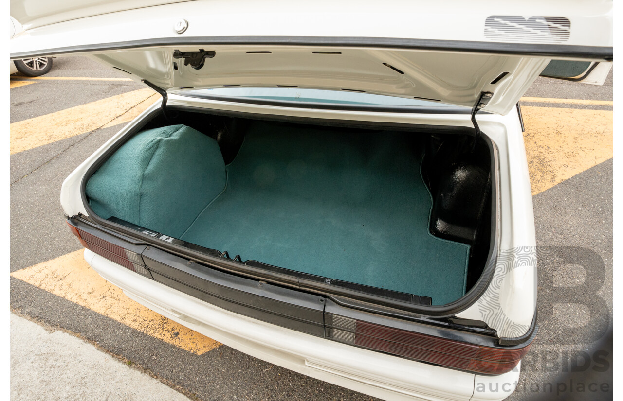 10/1984 Holden VK Commodore SL (134 Package) Group 3 Tribute 4d Sedan Alpine White V8 5.0L - Modified