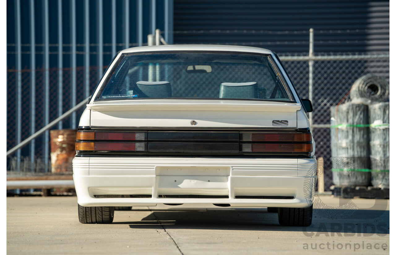10/1984 Holden VK Commodore SL (134 Package) Group 3 Tribute 4d Sedan Alpine White V8 5.0L - Modified