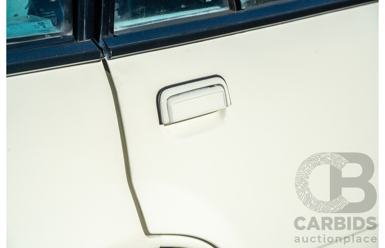 10/1984 Holden VK Commodore SL (134 Package) Group 3 Tribute 4d Sedan Alpine White V8 5.0L - Modified
