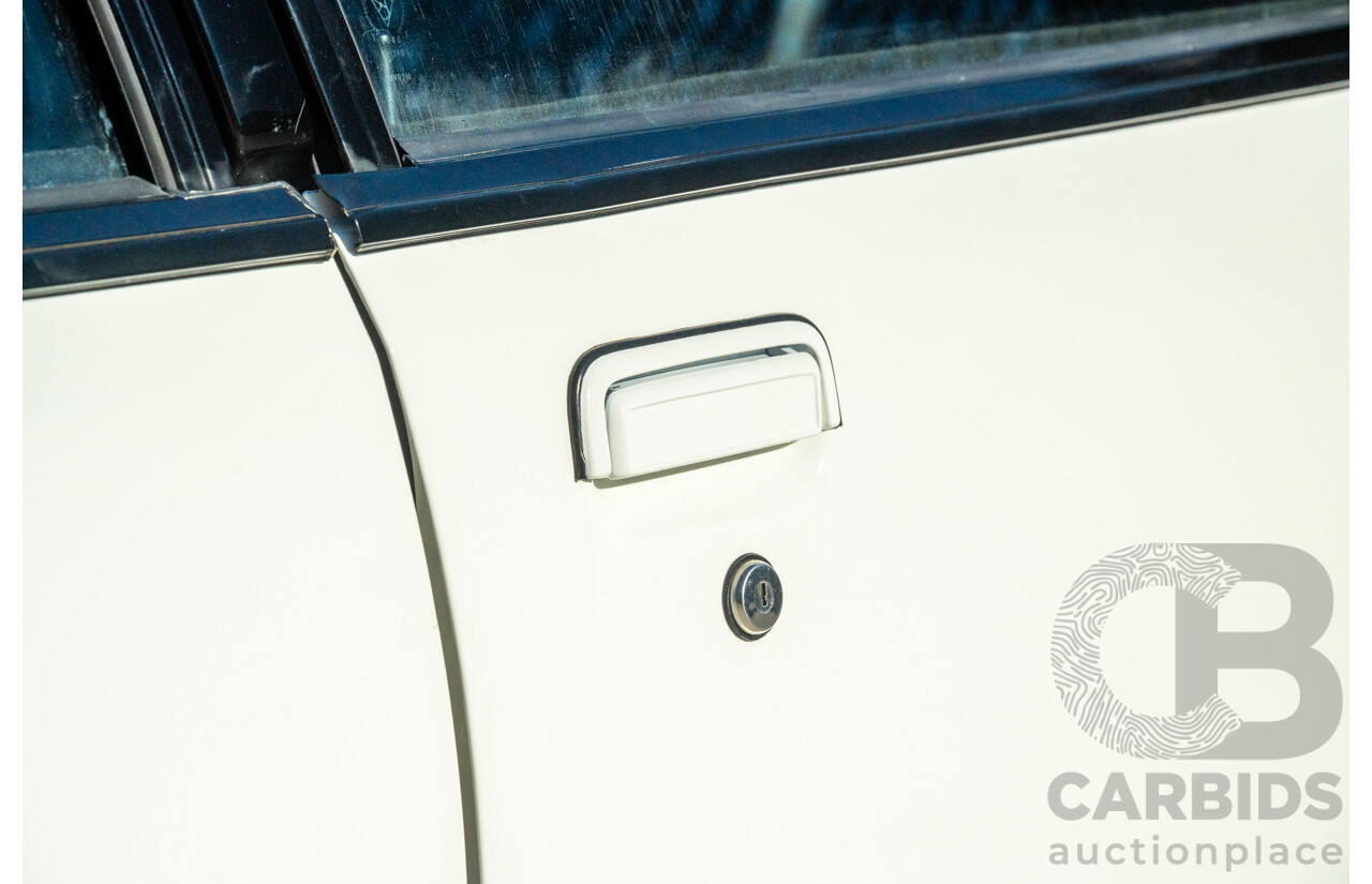 10/1984 Holden VK Commodore SL (134 Package) Group 3 Tribute 4d Sedan Alpine White V8 5.0L - Modified