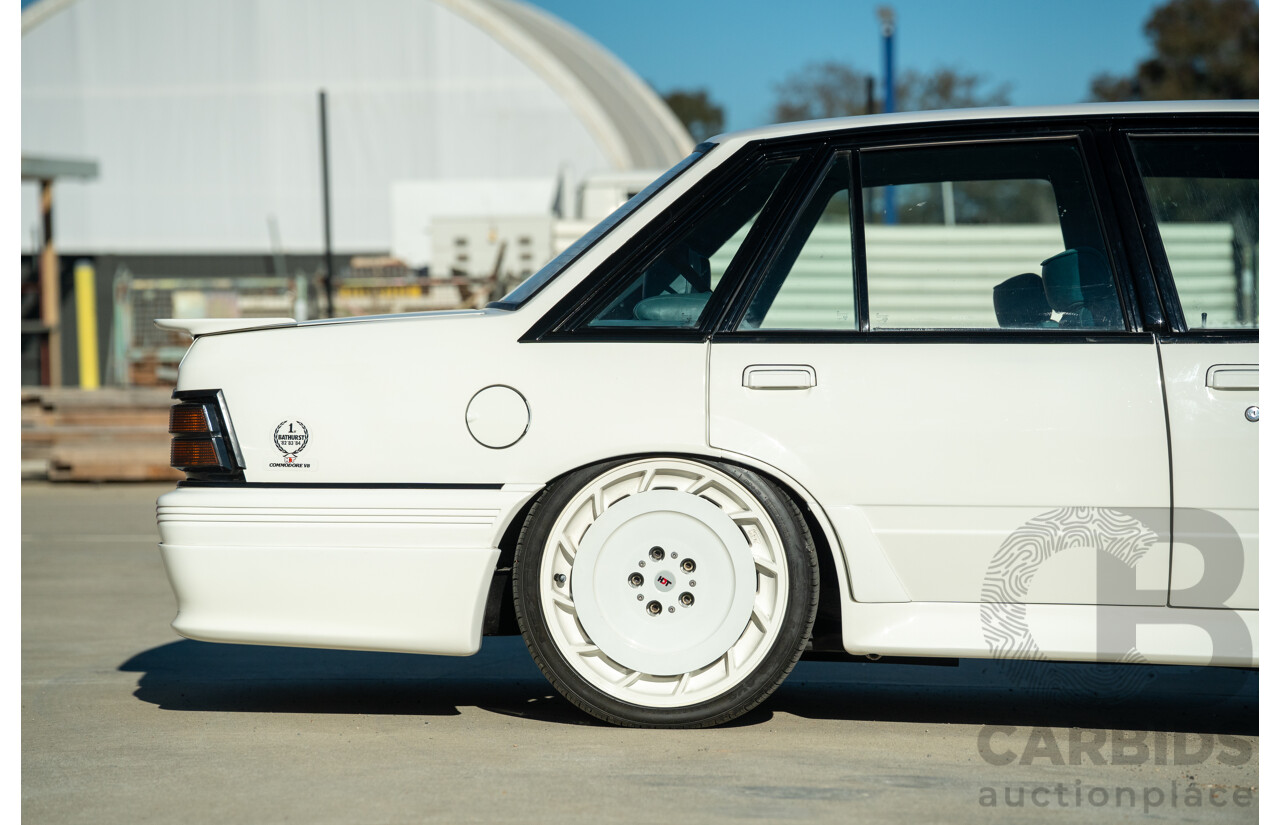 10/1984 Holden VK Commodore SL (134 Package) Group 3 Tribute 4d Sedan Alpine White V8 5.0L - Modified