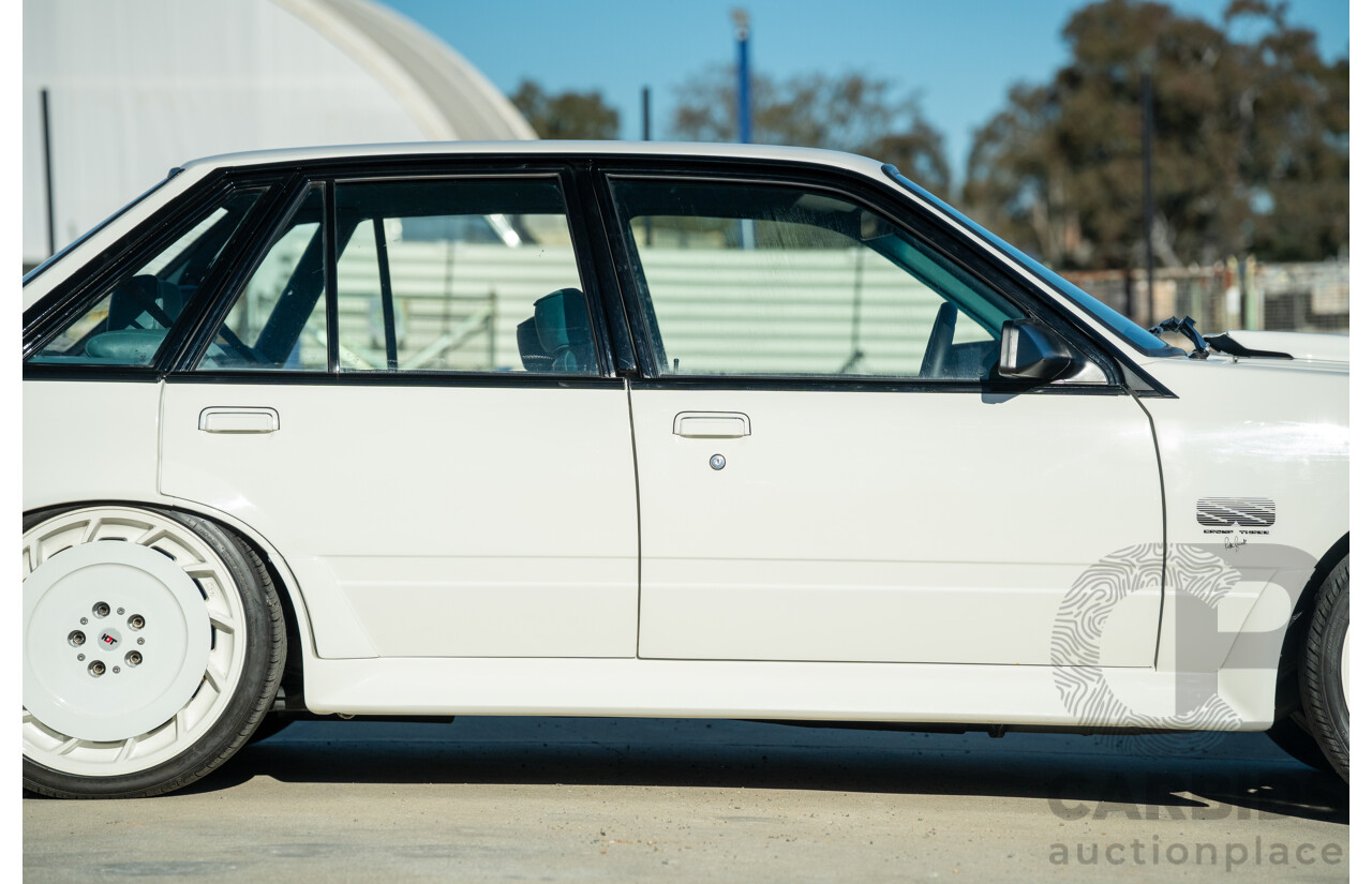 10/1984 Holden VK Commodore SL (134 Package) Group 3 Tribute 4d Sedan Alpine White V8 5.0L - Modified