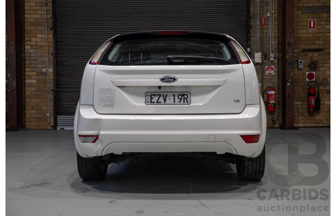 03/2010 Ford Focus LX FWD LV 5d Hatchback White 2.0L