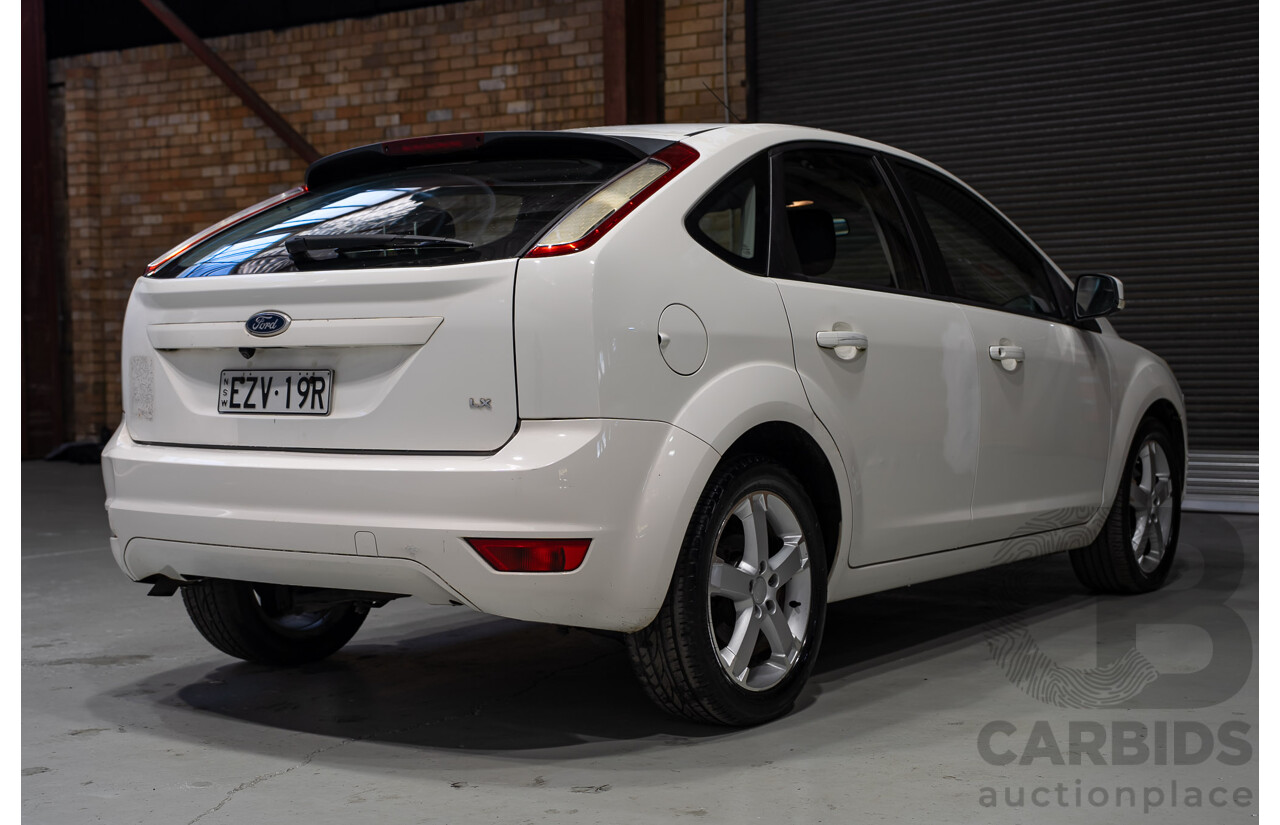 03/2010 Ford Focus LX FWD LV 5d Hatchback White 2.0L