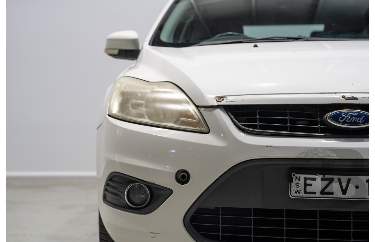 03/2010 Ford Focus LX FWD LV 5d Hatchback White 2.0L